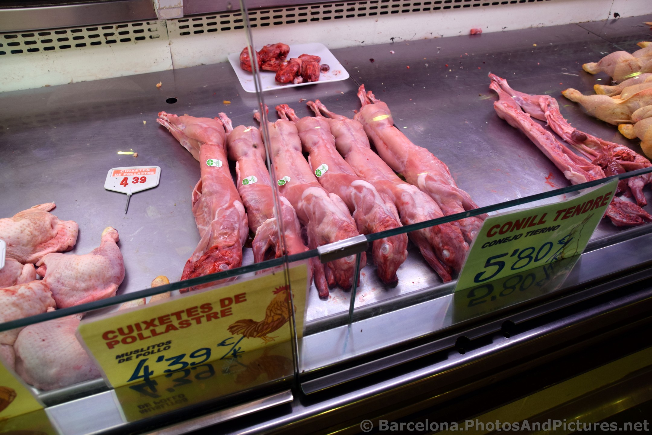 Whole Rabbits sold by Butcher at La Boqueria.jpg