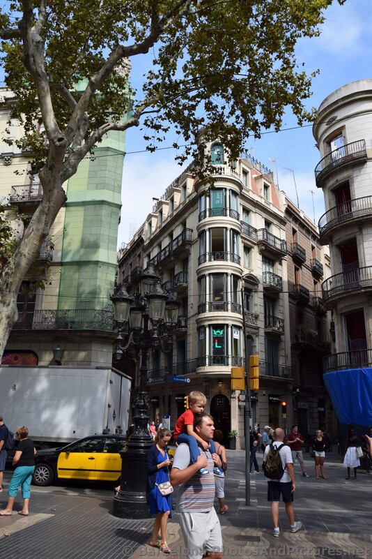 Man Carrying His Toddler Son on Shoulders at La Rambla Barcelona.jpg